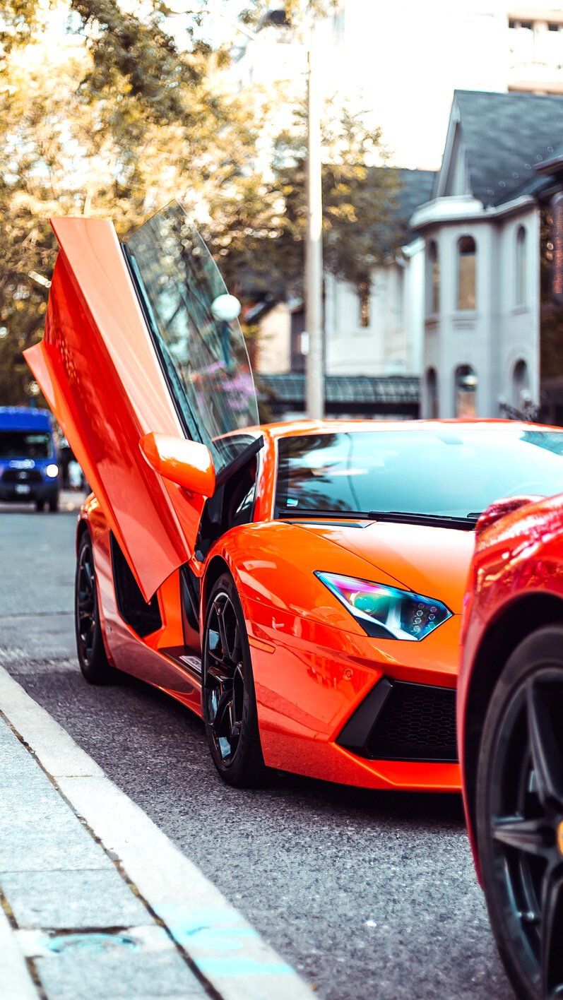 Orange Car Parked on the Street